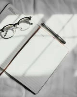 Notebook on the notebook pen and glasses